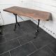 Bistro table with cast iron legs and solid wood top