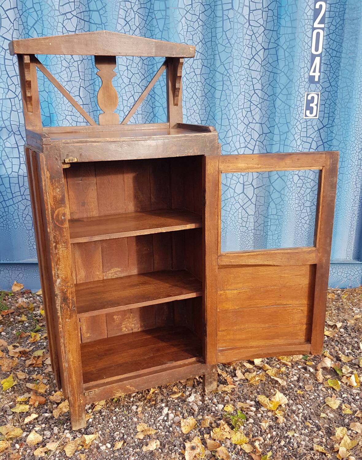 Glass side table in Burmese teak