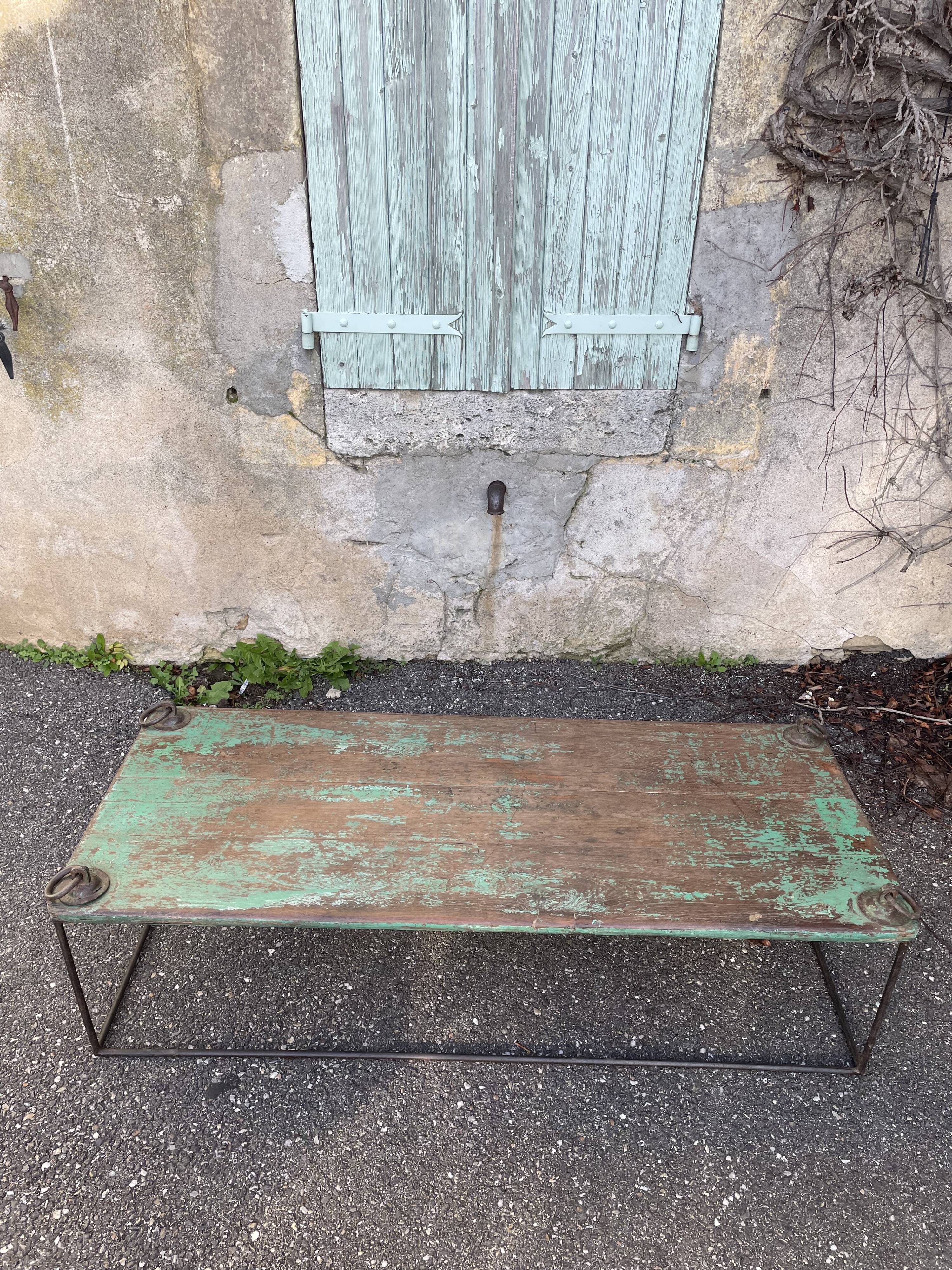 Pair of green teak coffee tables.
