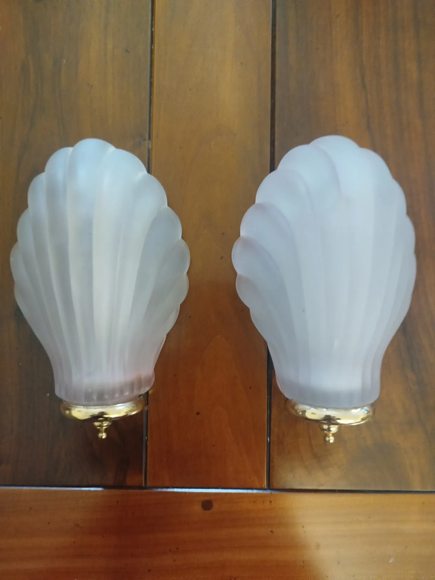 Pair of Art Deco shell wall sconces in frosted glass and brass.