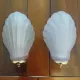 Pair of Art Deco shell wall sconces in frosted glass and brass.