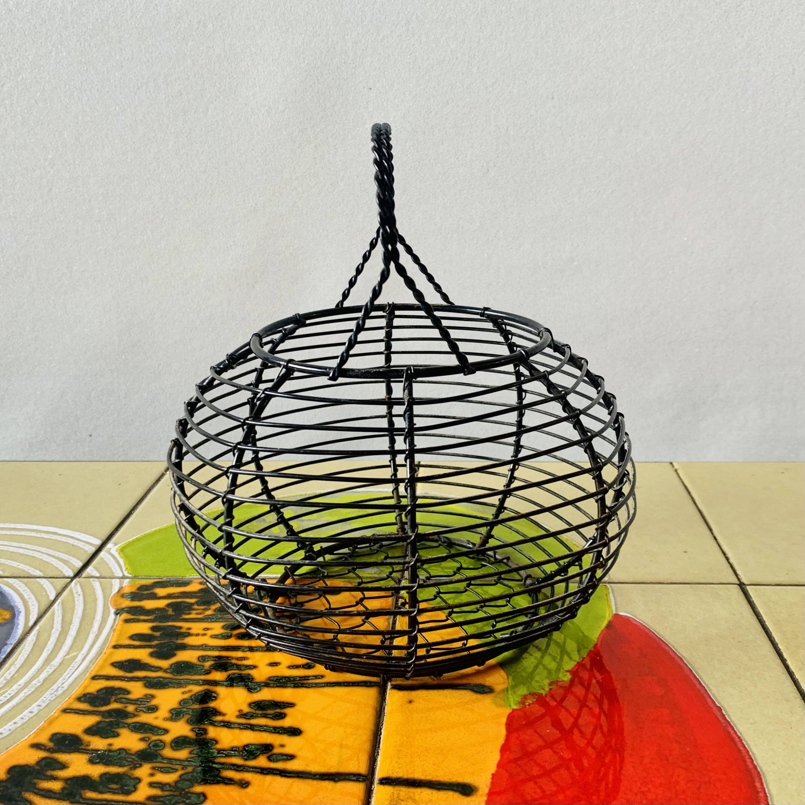 Vintage black metal egg basket