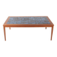 Danish coffee table in teak and blue ceramic.