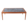 Danish coffee table in teak and blue ceramic.