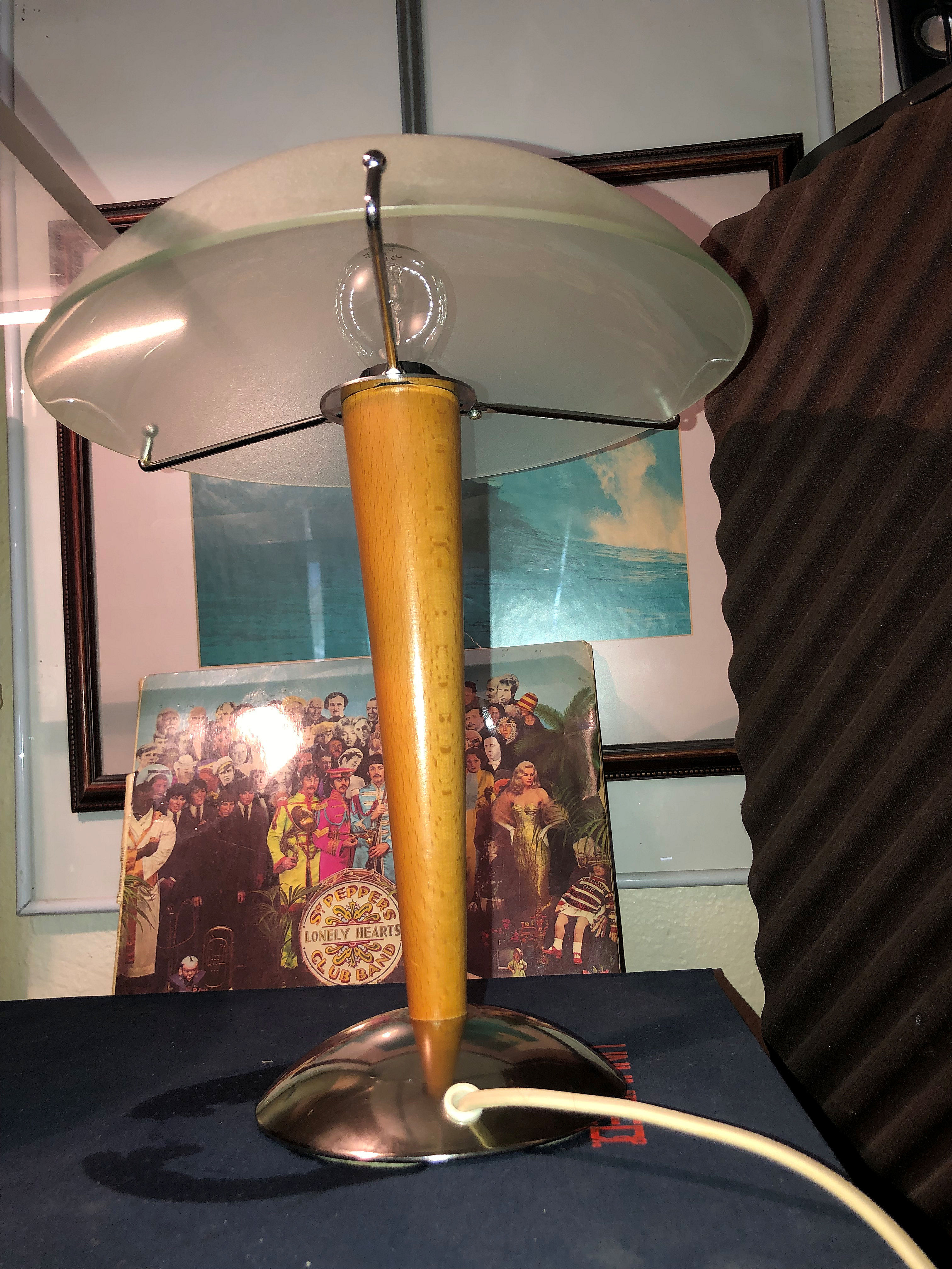 Table lamp legs chrome wood lampshade opaque glass.