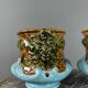 Paire de cache-pots en barbotine à décor de mascarons, XIXe siècle
