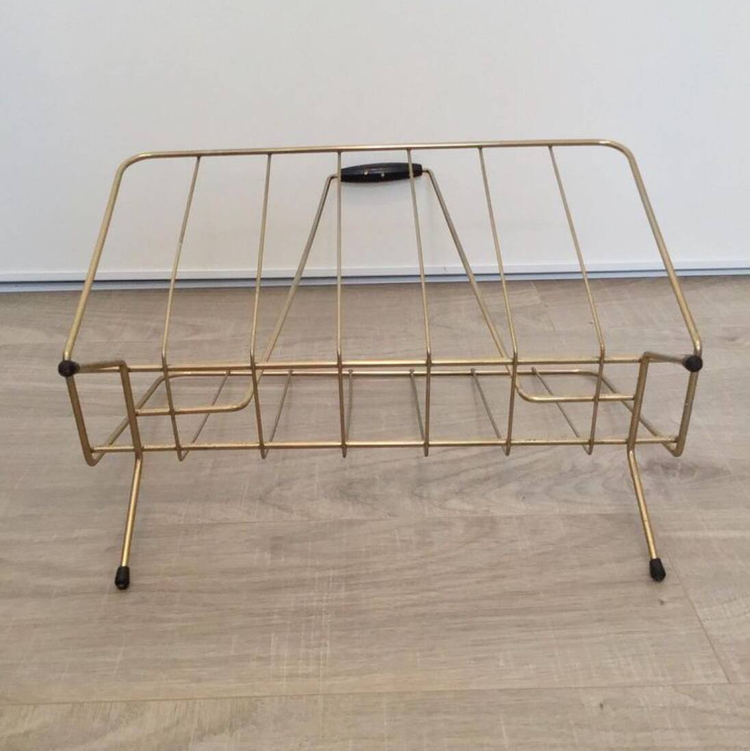 Vintage magazine rack in gold metal