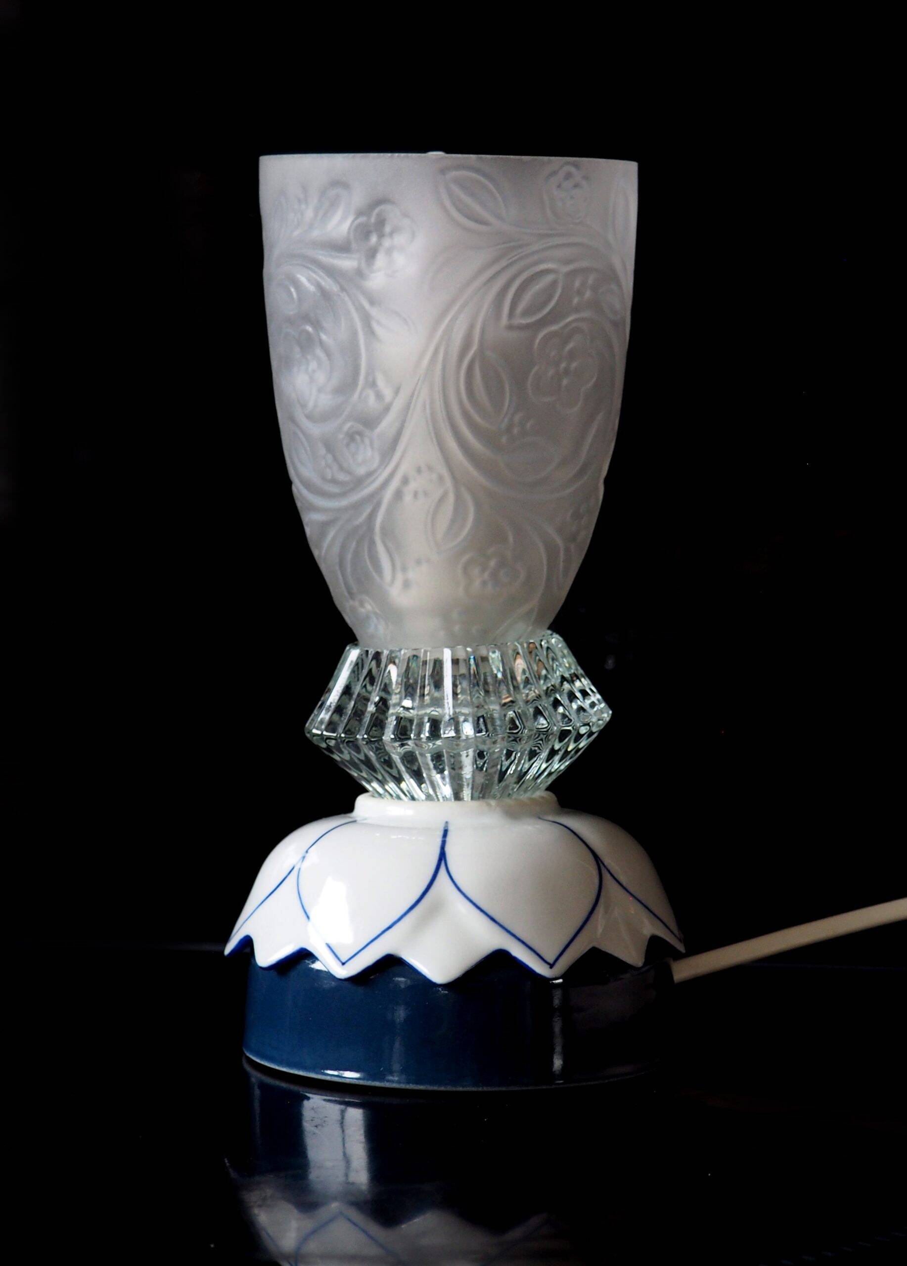 Glass lamp with floral relief in blue lotus design.