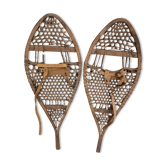 Pair of old snowshoes in wood, leather, and natural gut string