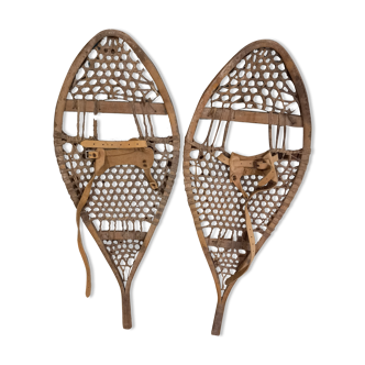 Pair of old snowshoes in wood, leather, and natural gut string