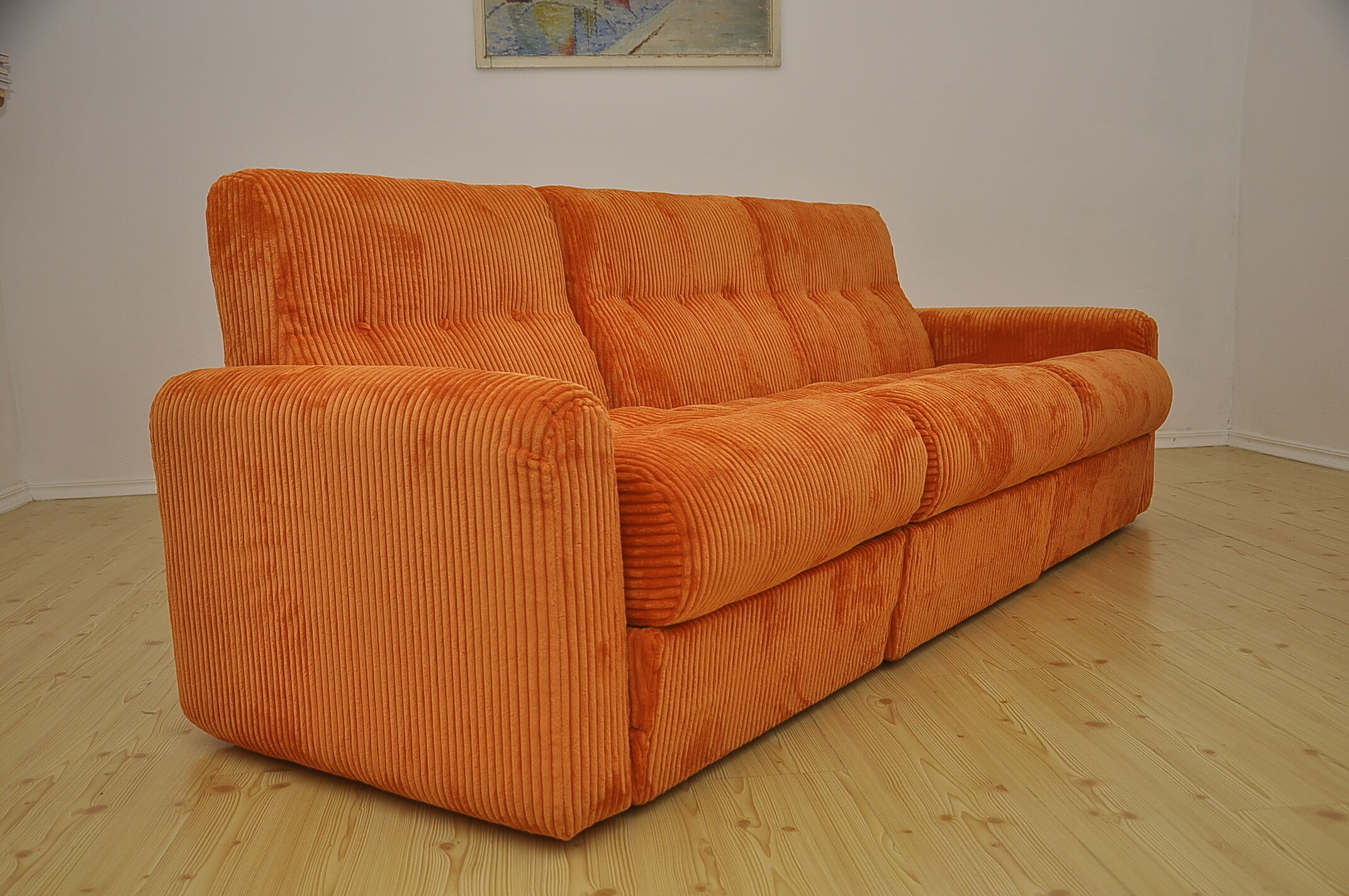 Orange corduroy modular sofa, 1970s.