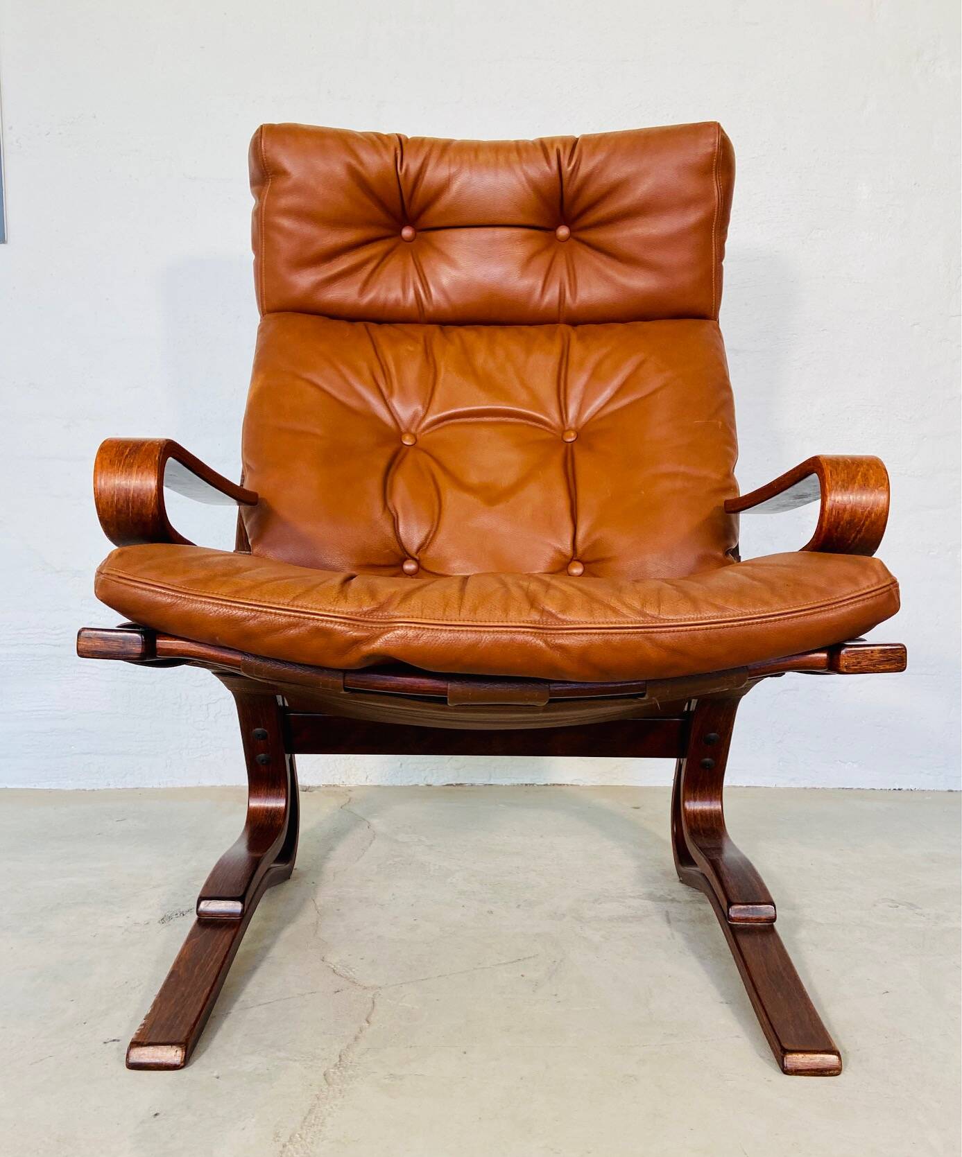Vintage scandinavian cognac lounge chair by oddvin rykken 1960s