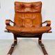 Vintage scandinavian cognac lounge chair by oddvin rykken 1960s