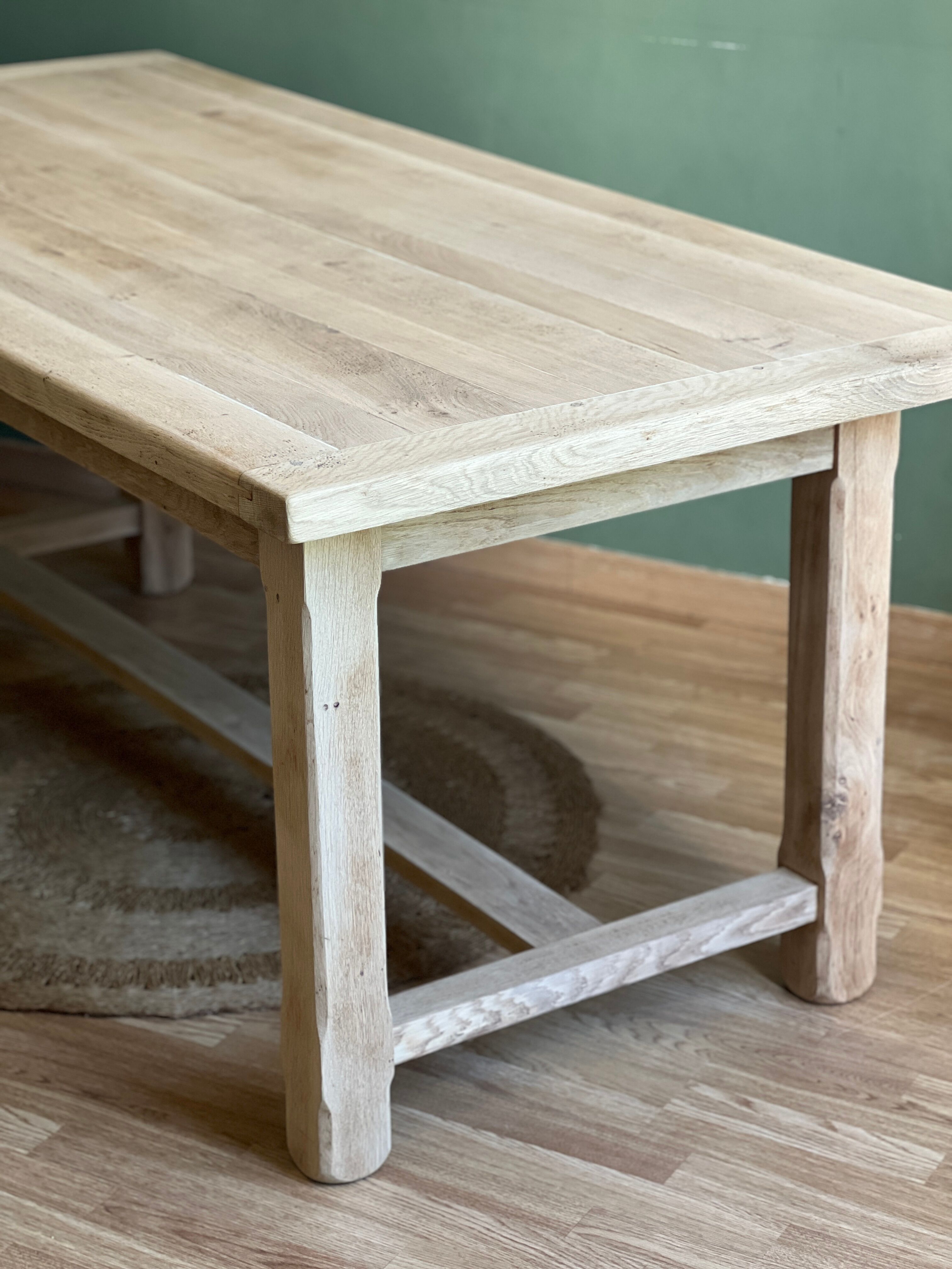 Farm table made of solid light oak wood.