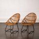 Rattan armchair with metal legs