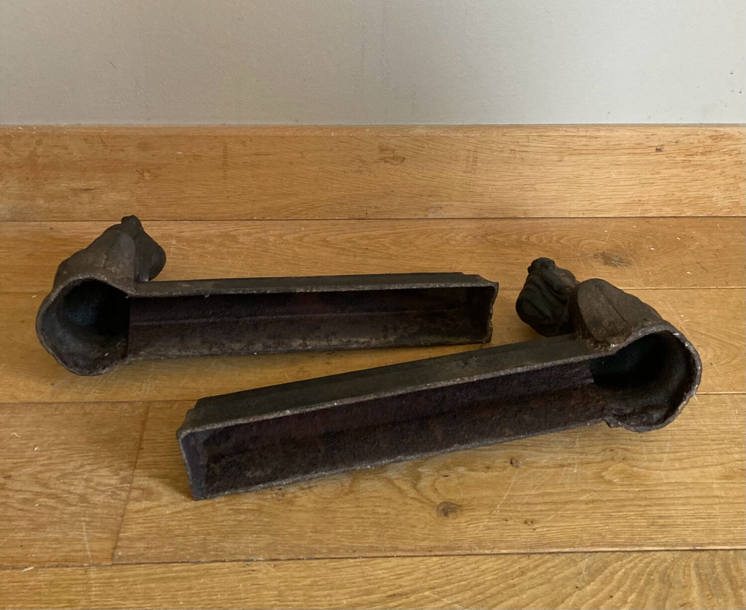 Pair of cast iron andirons from the 19th century, busts of women