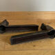 Pair of cast iron andirons from the 19th century, busts of women