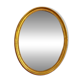 Miroir Deknudt ovale cadre doré.
