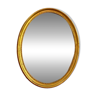 Deknudt oval gold frame mirror.