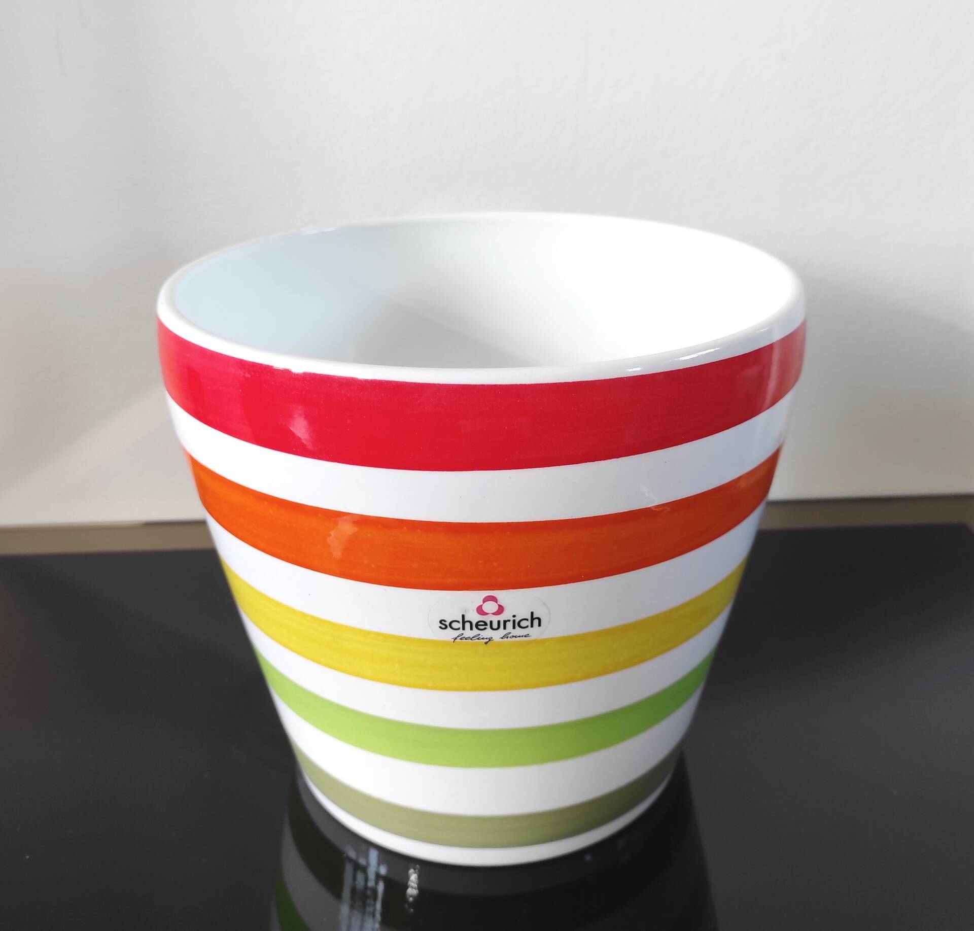 Vintage ceramic cache-pot with multicoloured stripes.