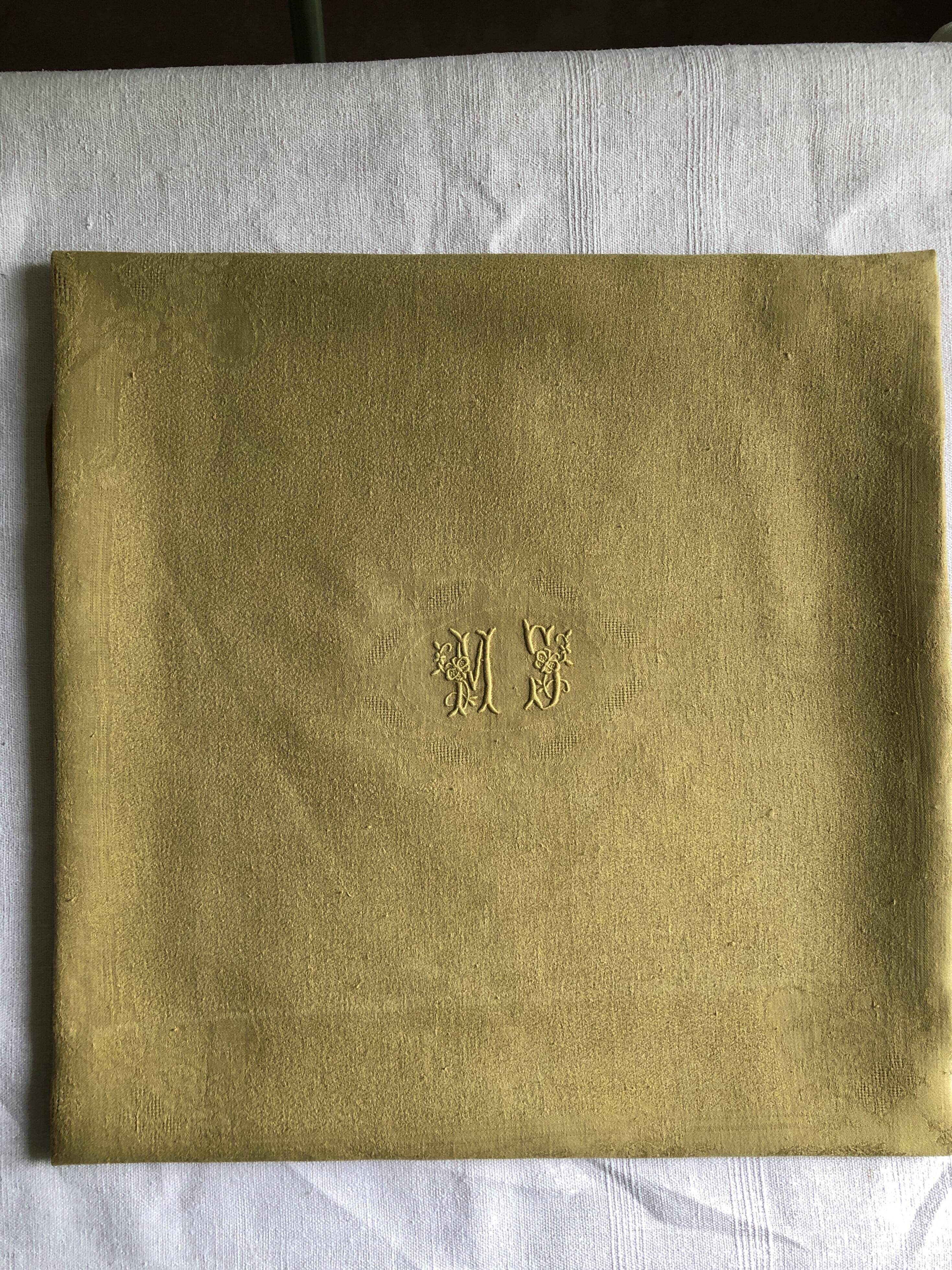 Old linen tablecloth and evening tinted in vermeil