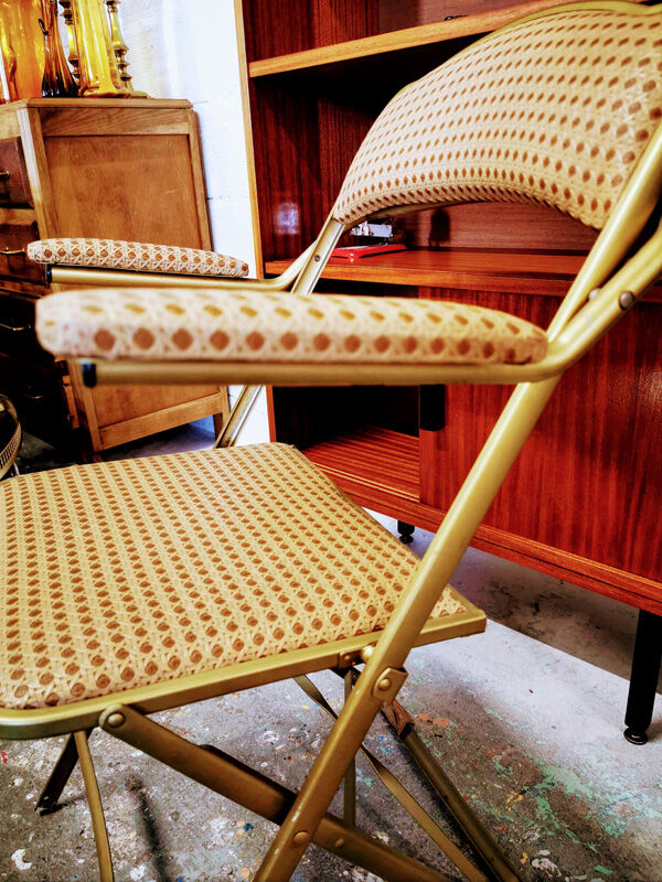 Folding gold arm chair