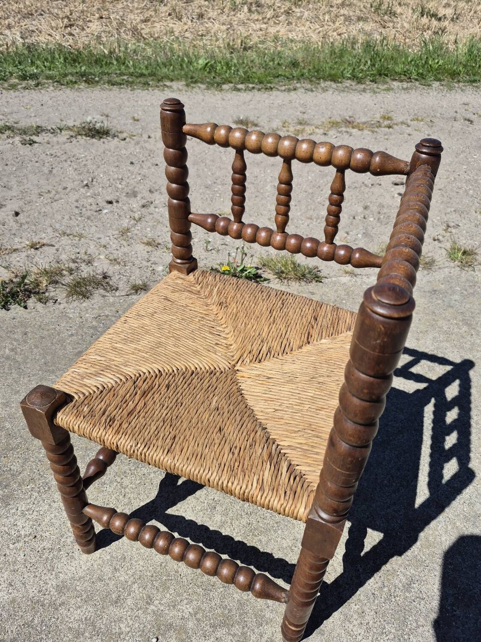 Vintage Dutch rustic corner chair bobbin turned oak with rush seating