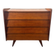 Vintage wooden chest of drawers with tapered legs.
