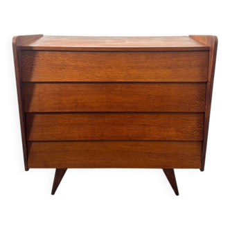 Vintage wooden chest of drawers with tapered legs.