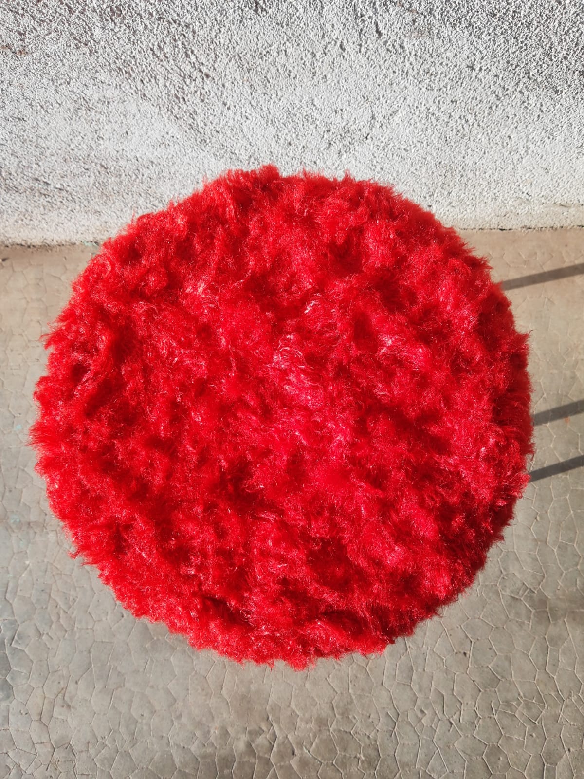 Tripod stool with vintage red moumoute seat