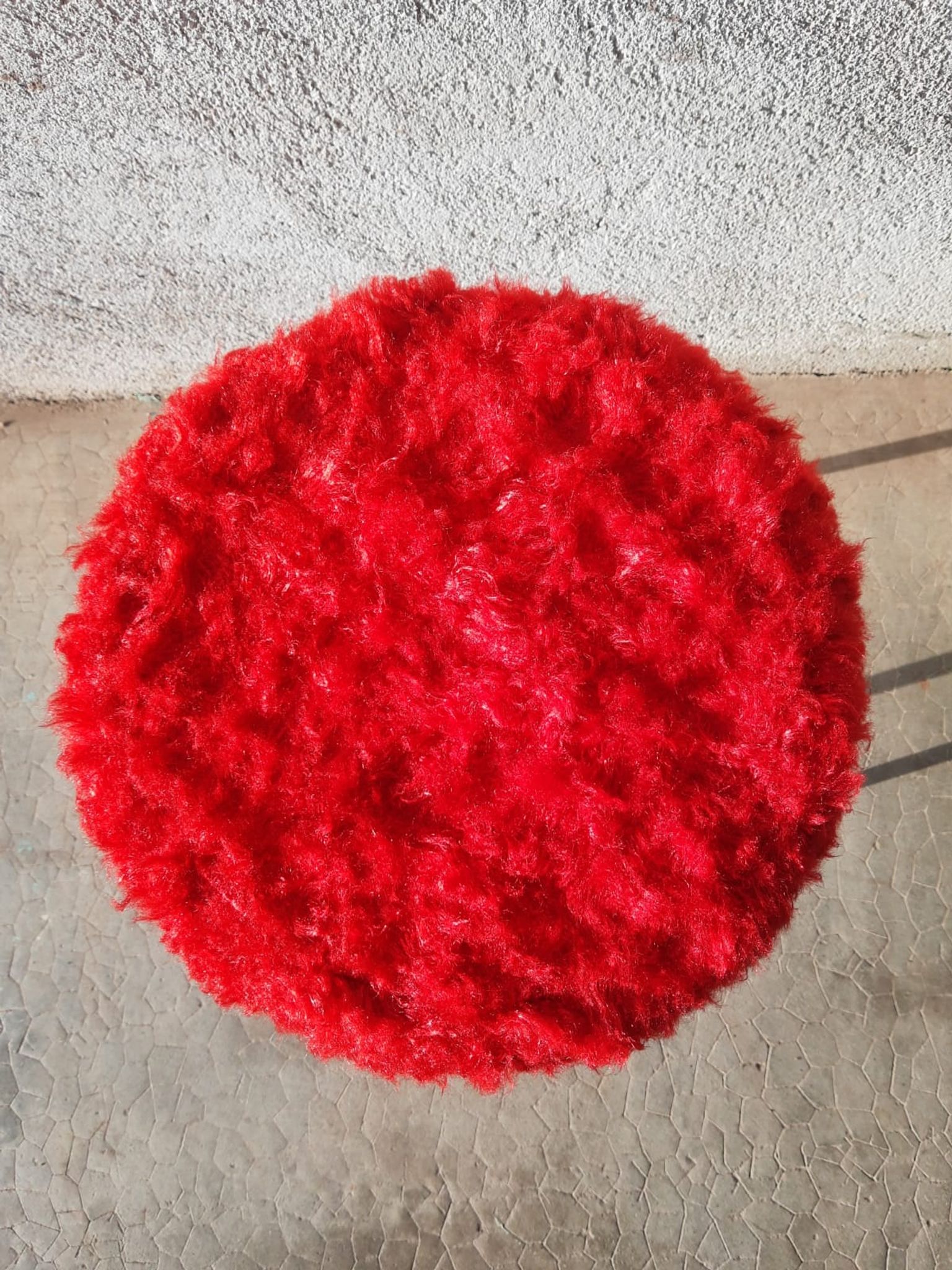 Tripod stool with vintage red moumoute seat