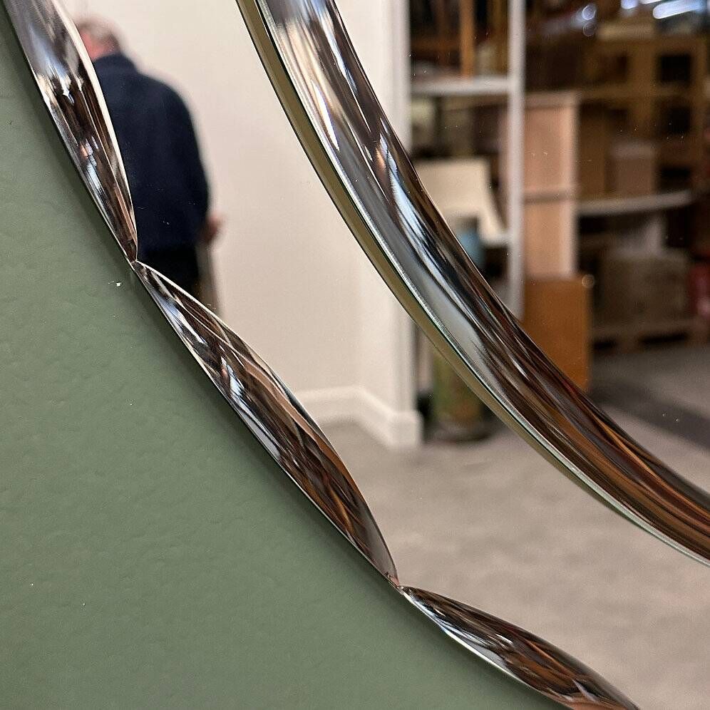 1970s Italian oval mirror by Crystal Arte with faceted glass frame