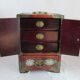 Chinese wooden jewelry box adorned with jade plates