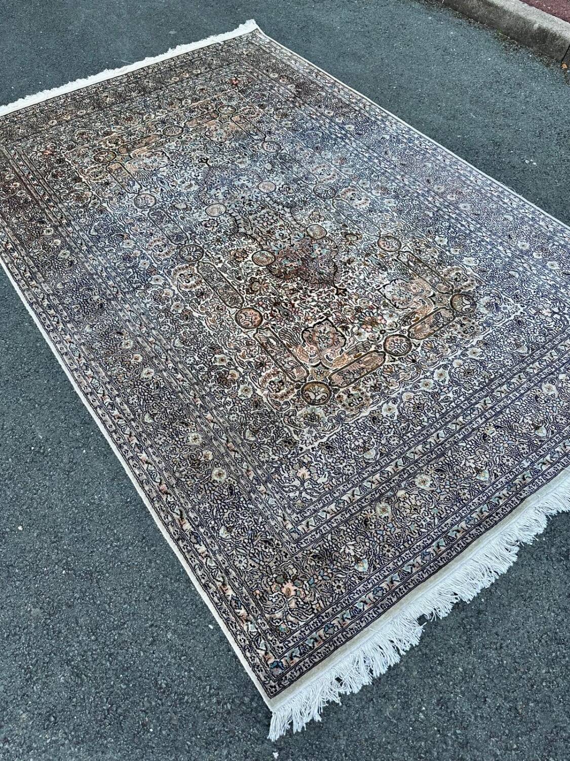 Hand-knotted Persian silk rug
