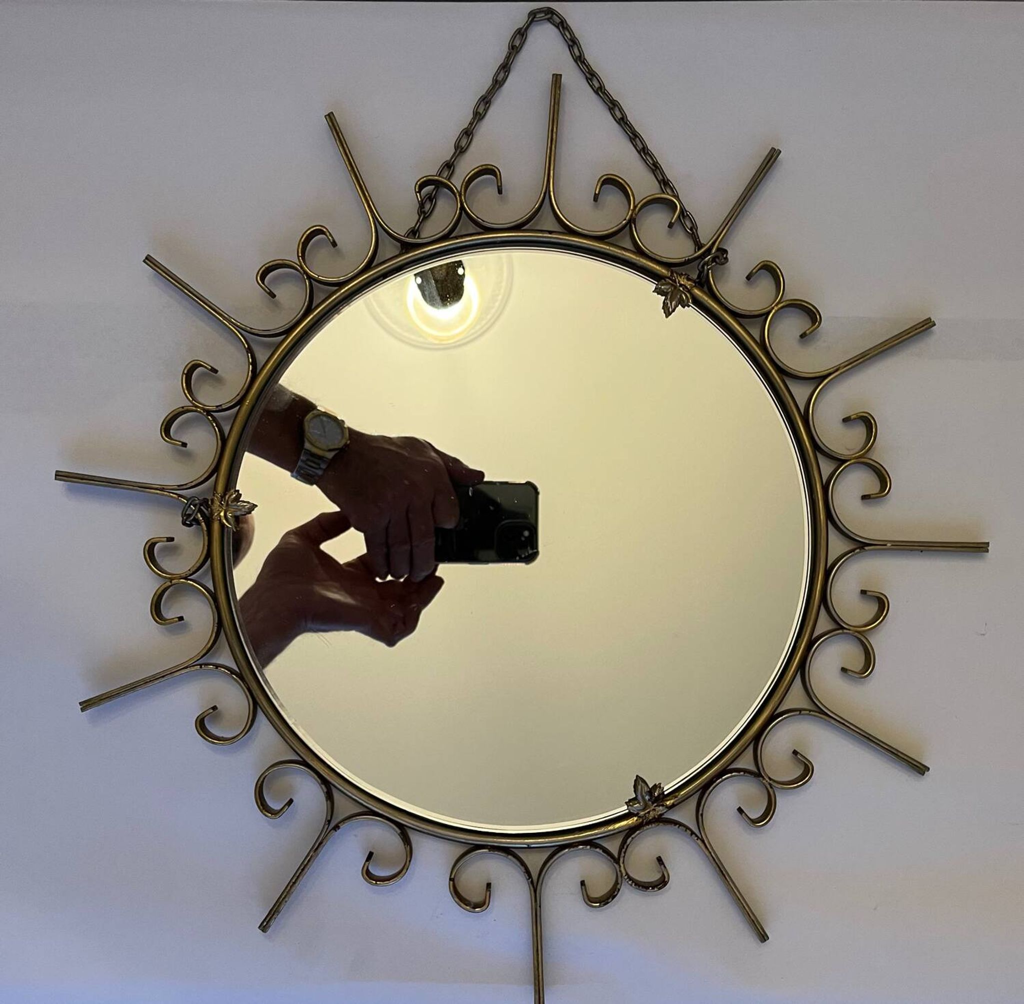 Miroir soleil en métal doré