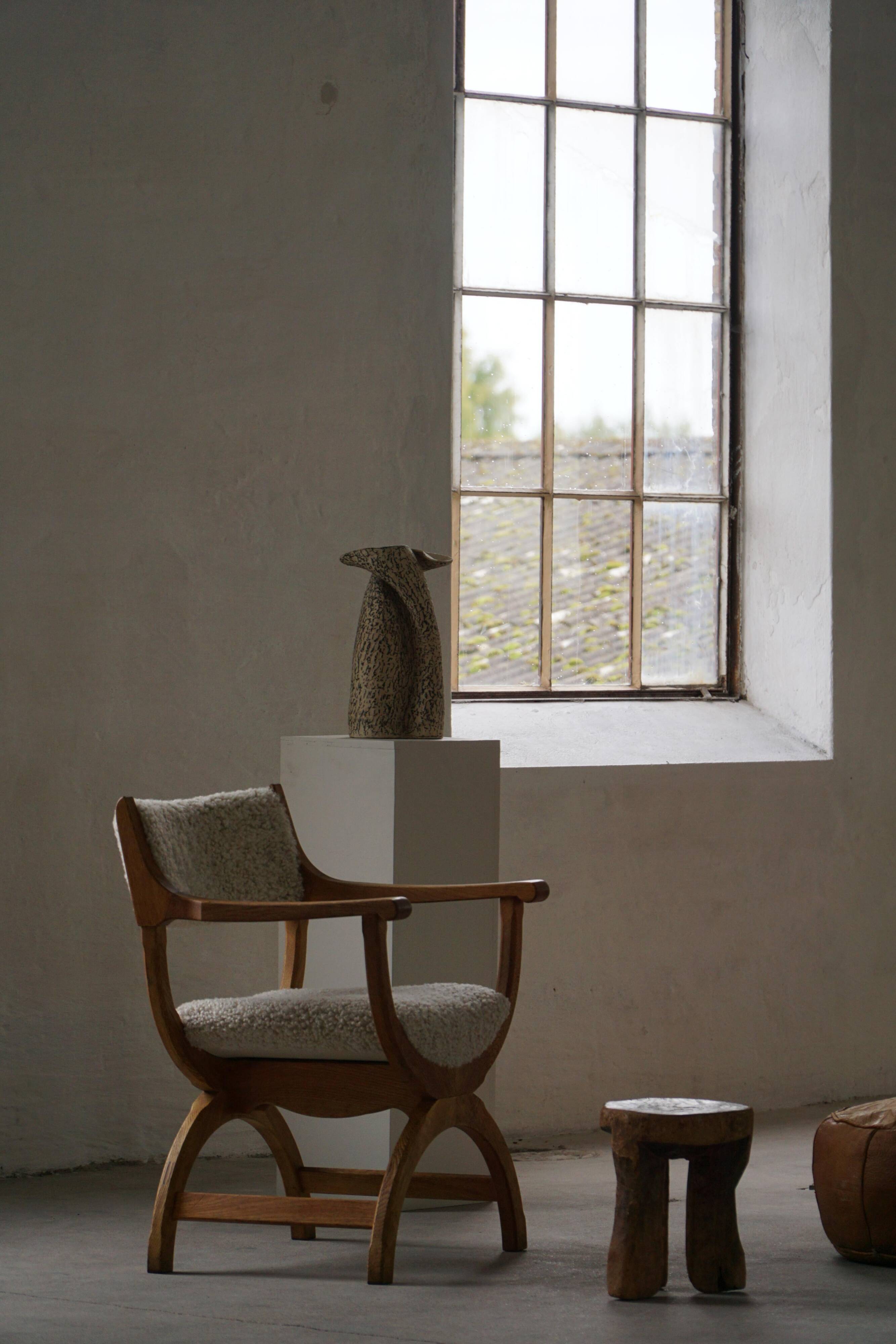 Henning Kjærnulf, Oak and lambswool armchair, "Kurul" model, Mid-century, 1960s