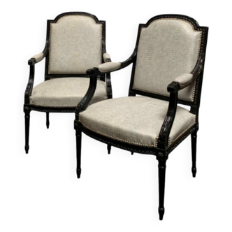 Pair of Louis XVI style armchairs in black lacquered oak. Crocodile fabric cover