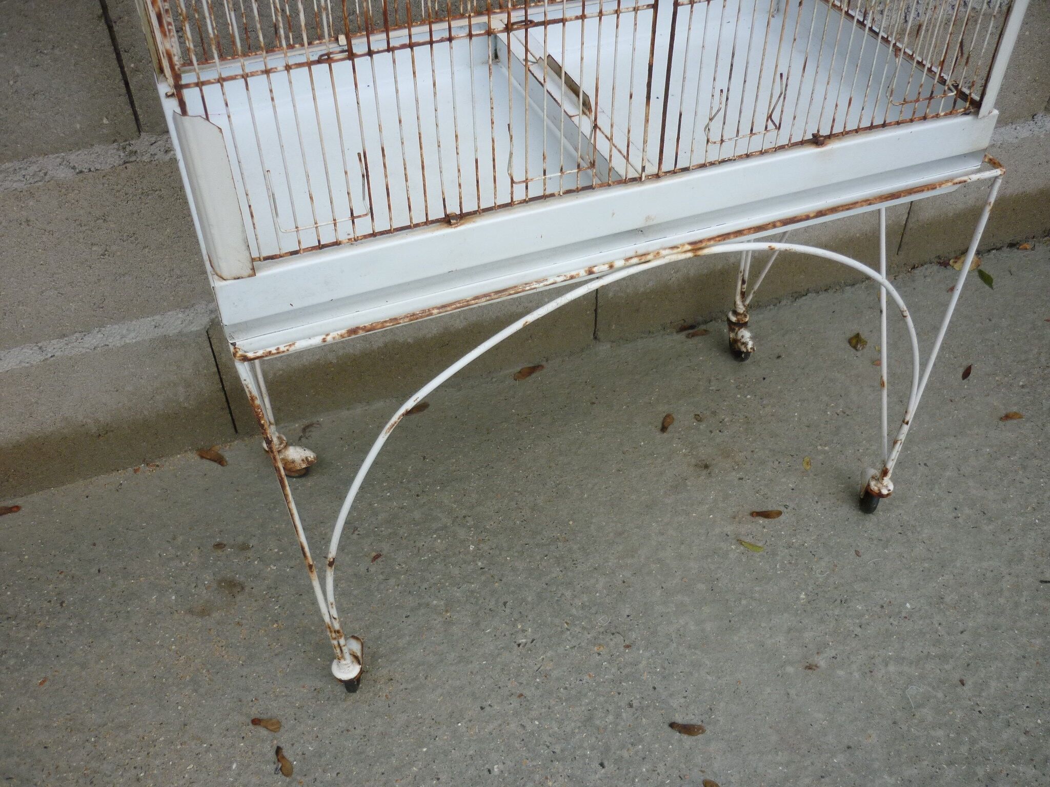 Bird cage with its wheeled holder