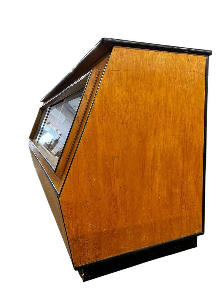 Vintage wooden shop counter with display case