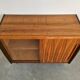 Mid-Century Modern walnut buffet with two compartments.