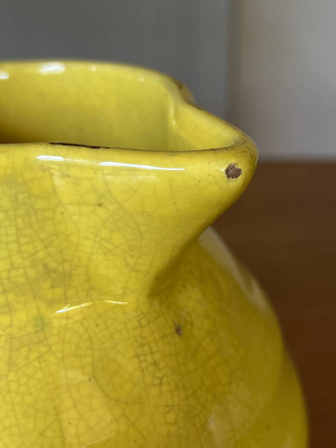 Old yellow ceramic pitcher