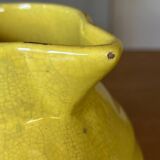 Old yellow ceramic pitcher
