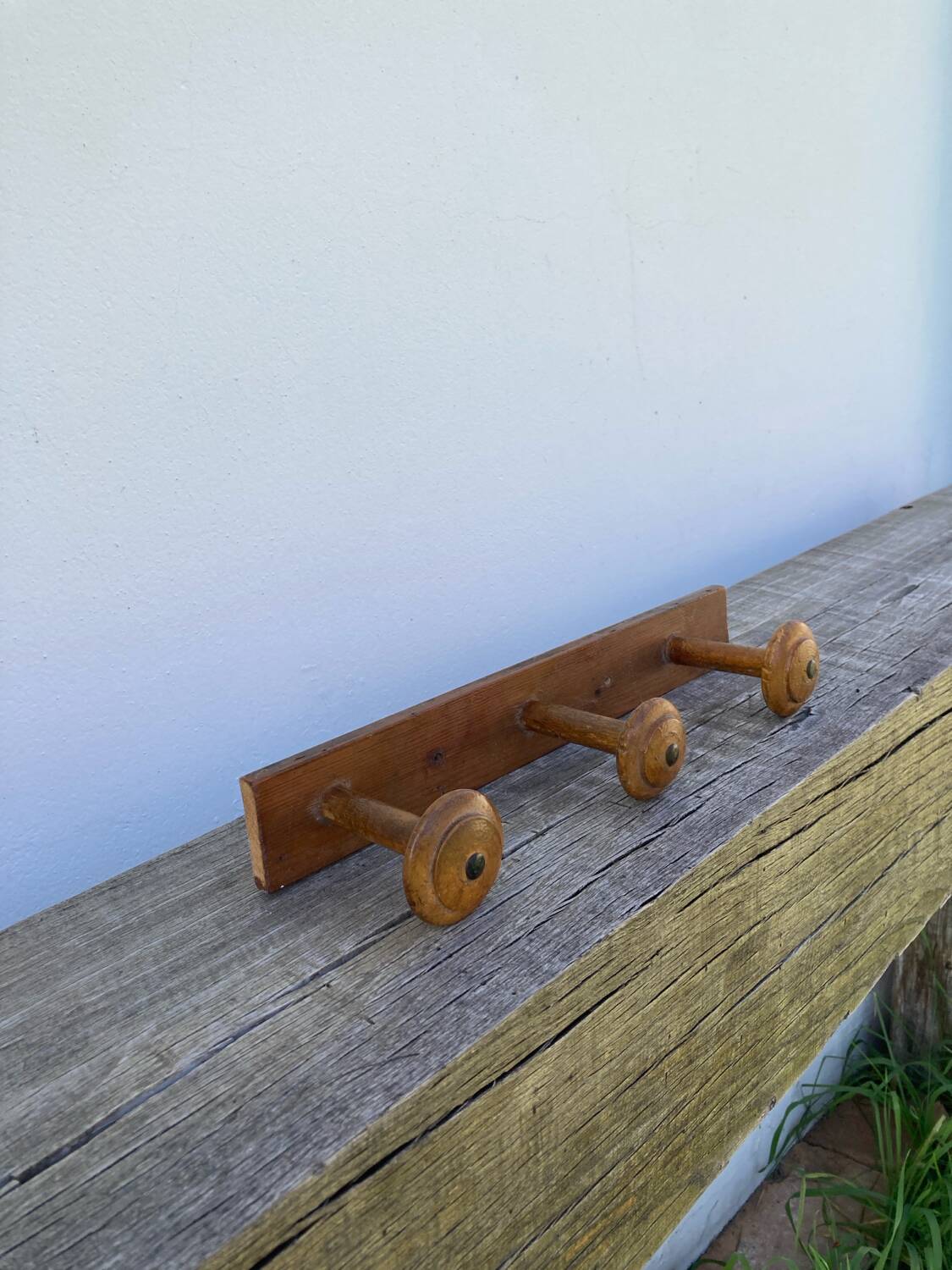 Old wooden wall coat rack