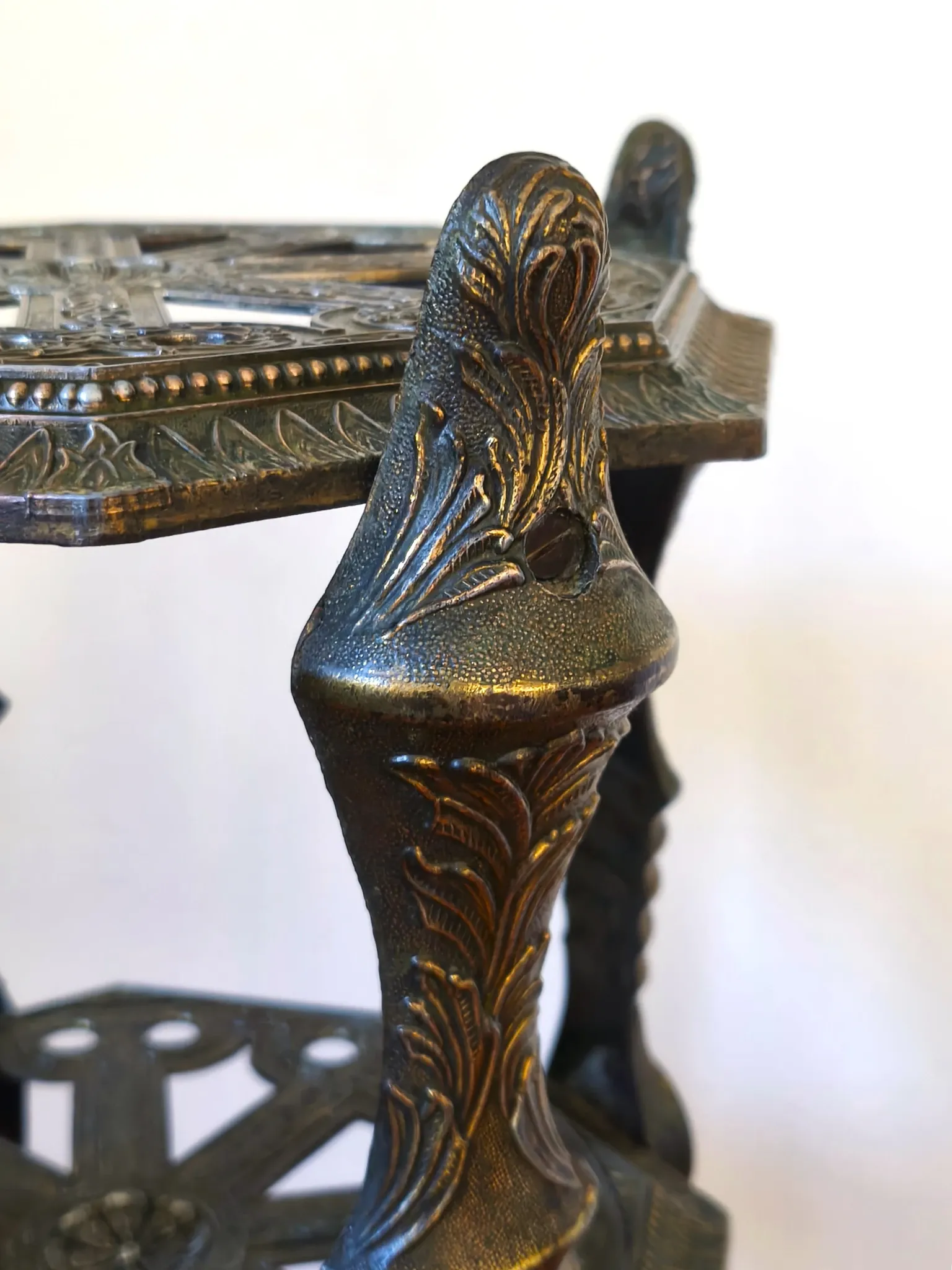Italian side table with three openwork shelves in patinated metal.