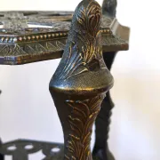 Italian side table with three openwork shelves in patinated metal.