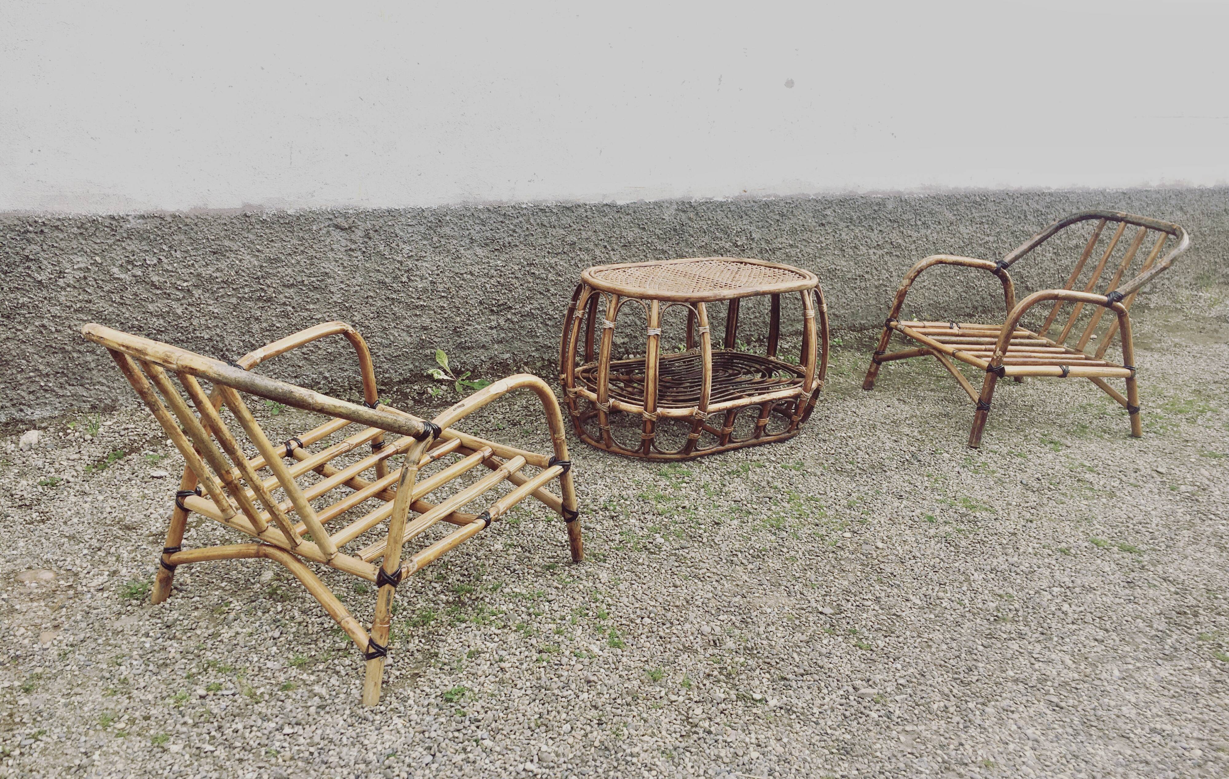 Pair of rattan armchairs and vintage oval table