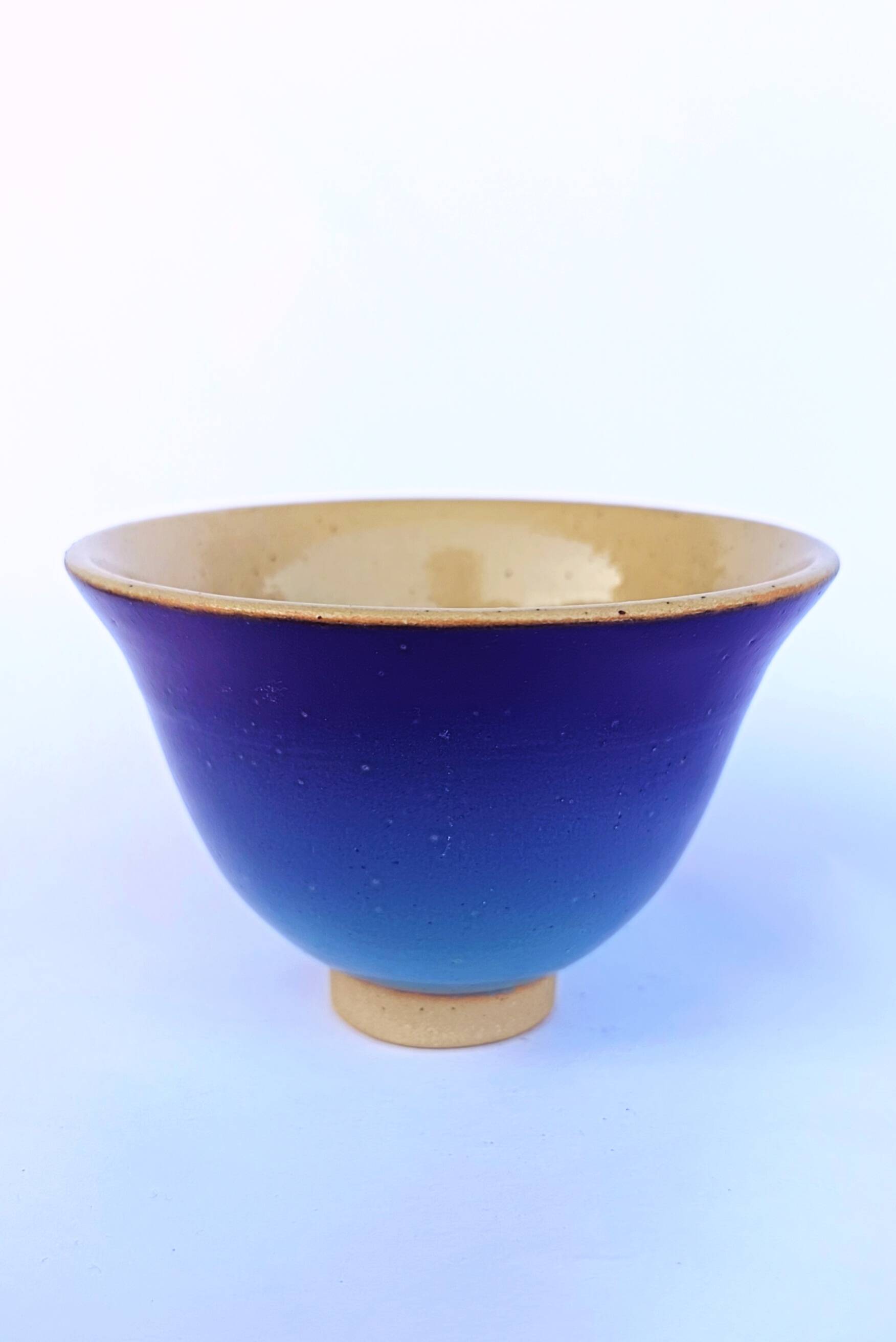 Blue glazed stoneware bowl on a foot, signed SP, Puisaye.