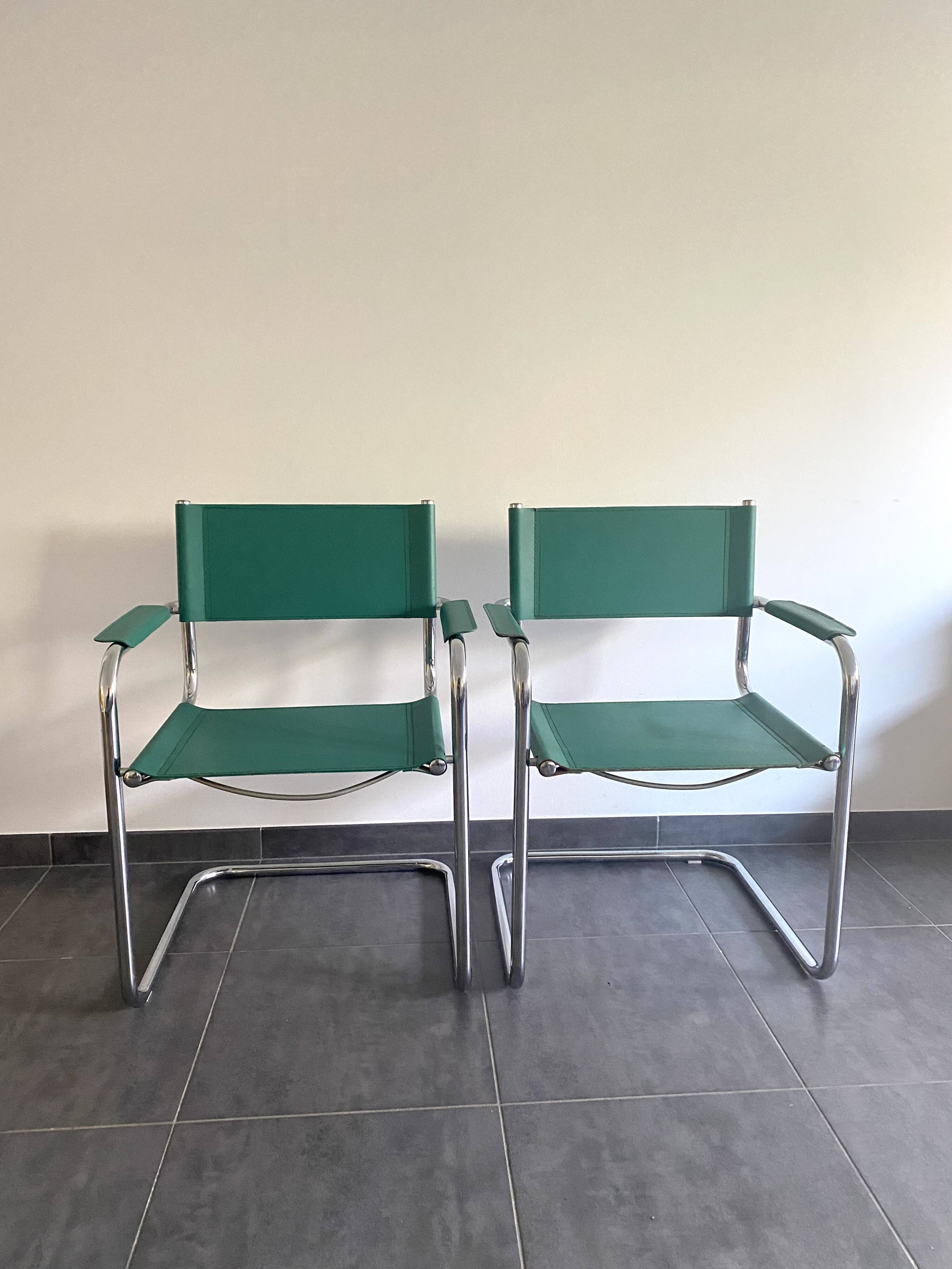 Pair of faux leather and chrome armchairs