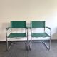 Pair of faux leather and chrome armchairs