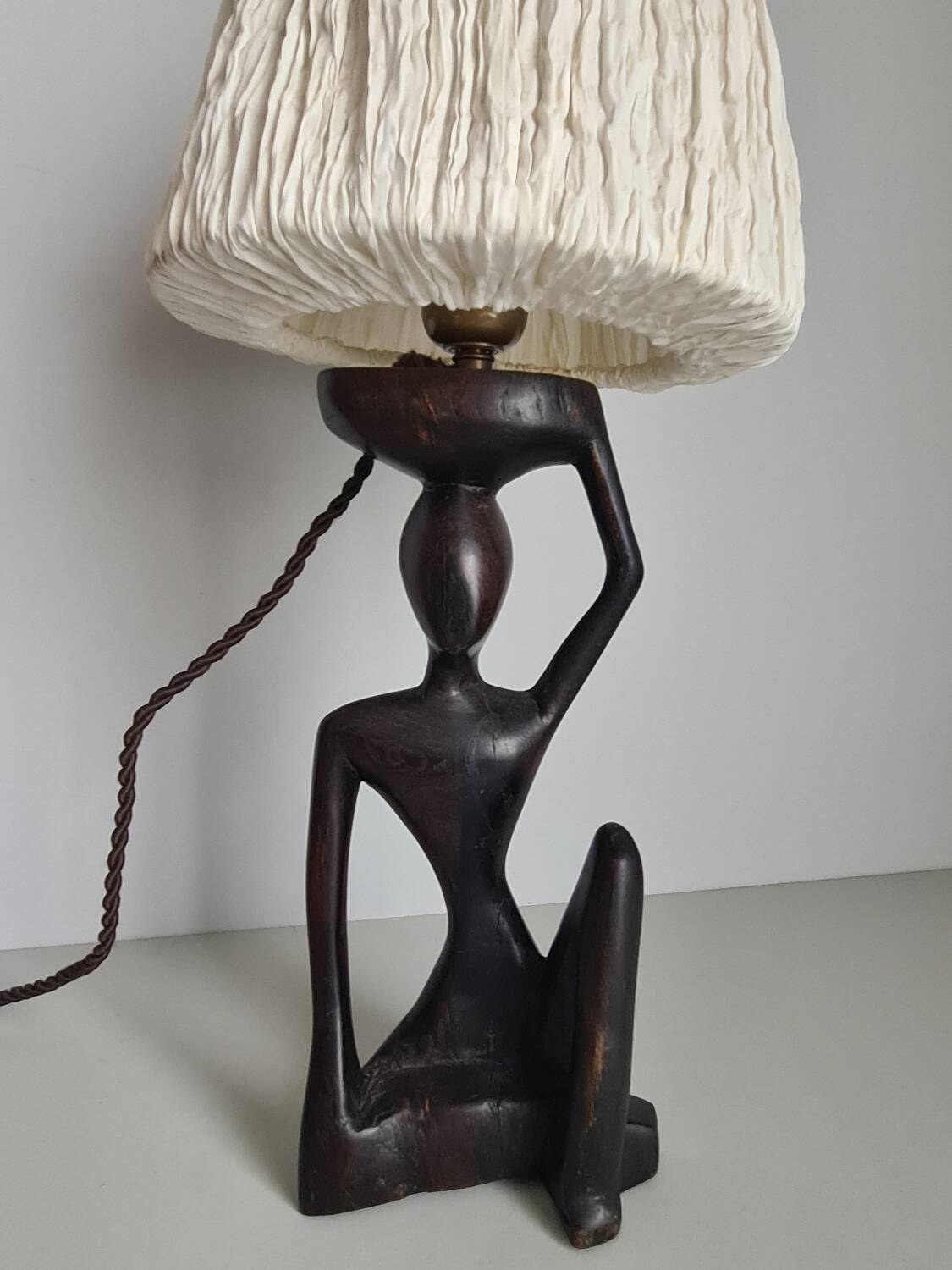 Ebony lamp with seated woman / 1930s